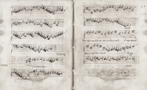 Old handwritten musical score on aged paper — Foto por Europeana na Unsplash